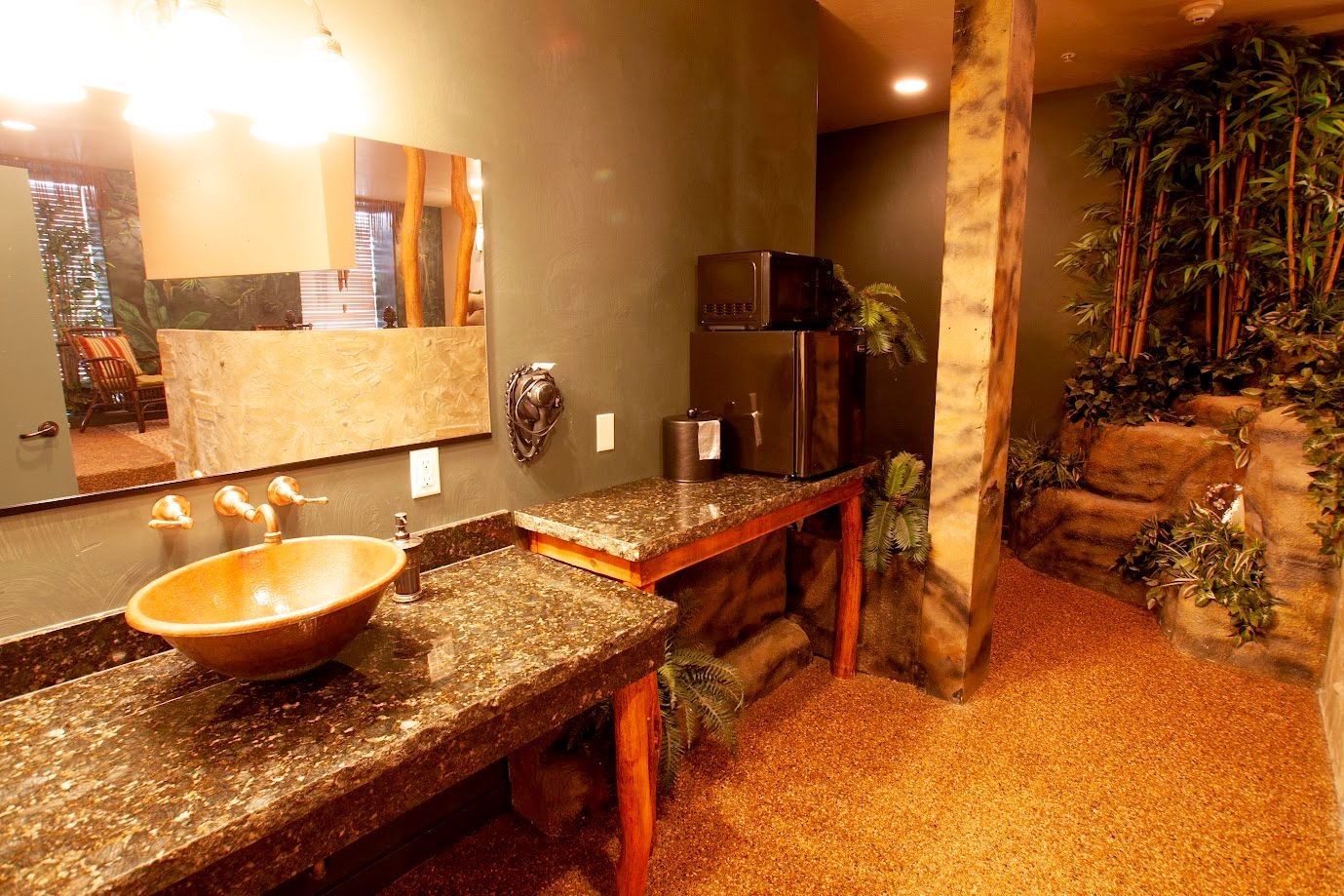 A bathroom with a sink and a large mirror