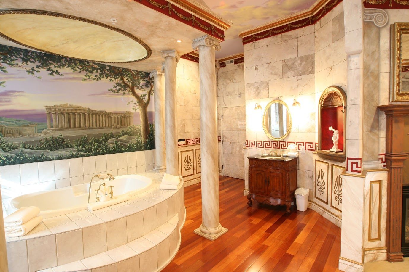 A bathroom with a bathtub and a painting on the wall