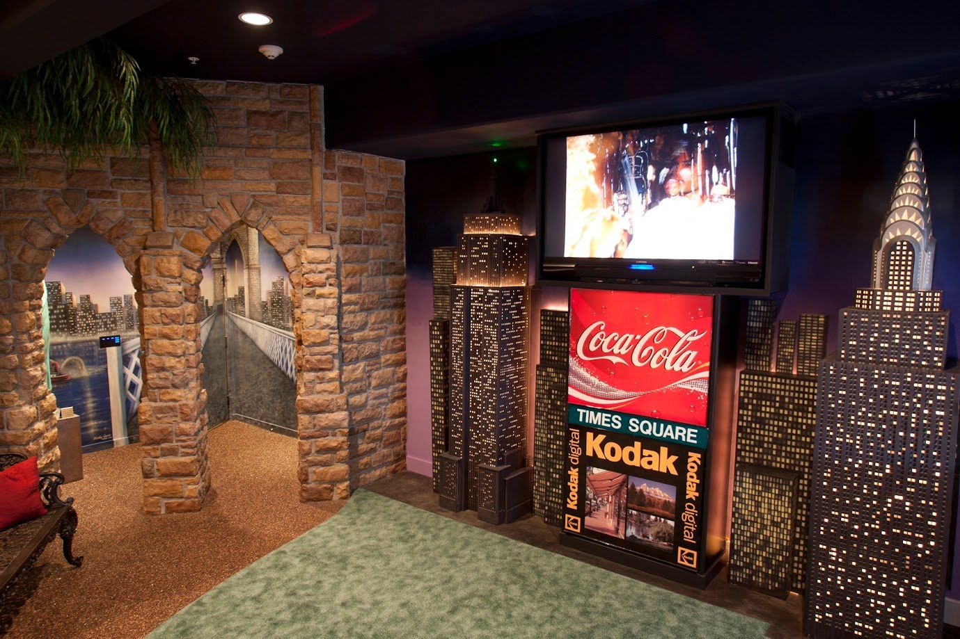 A room with a coca cola sign and a kodak sign