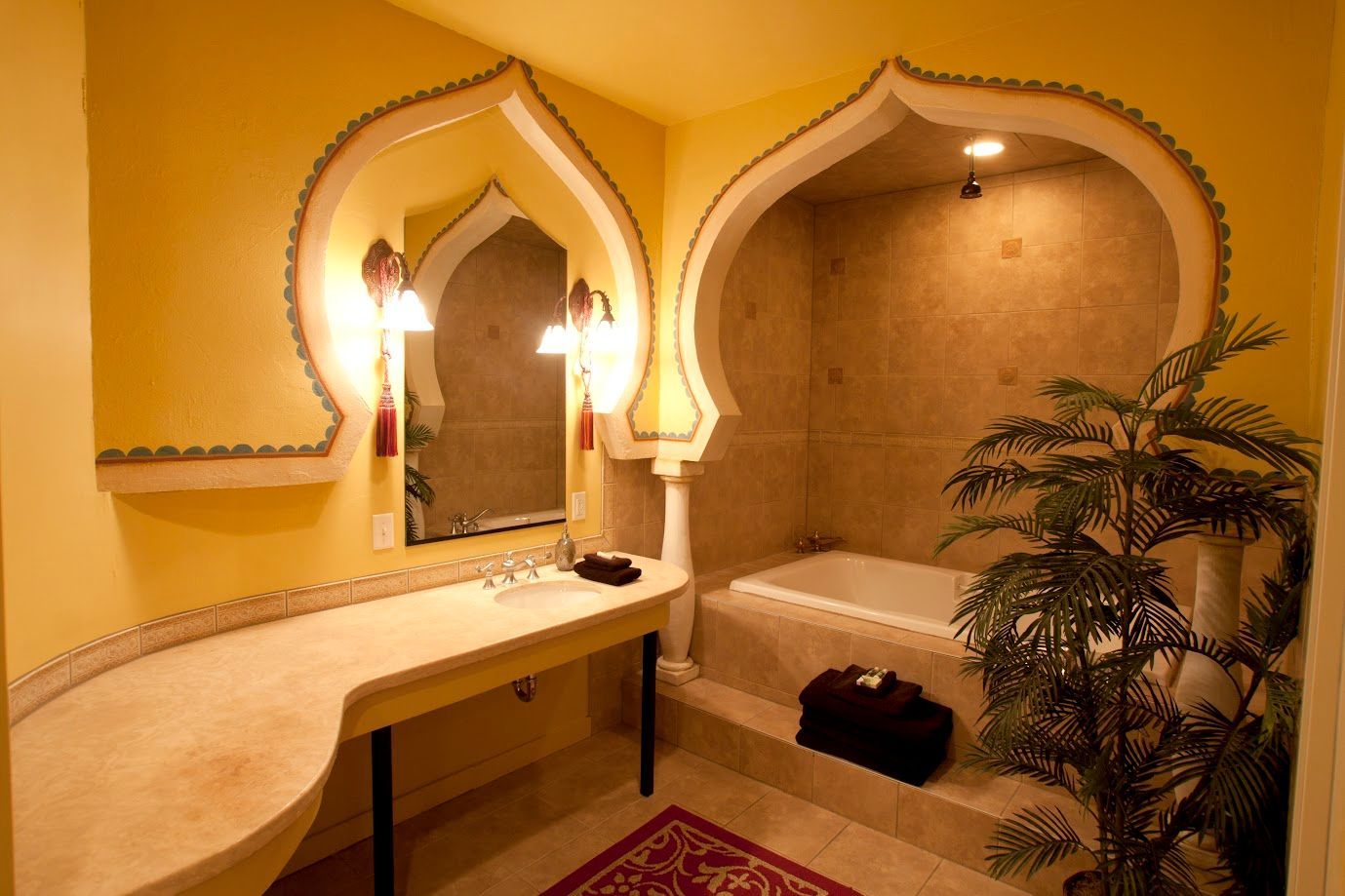 A bathroom with yellow walls and a bathtub