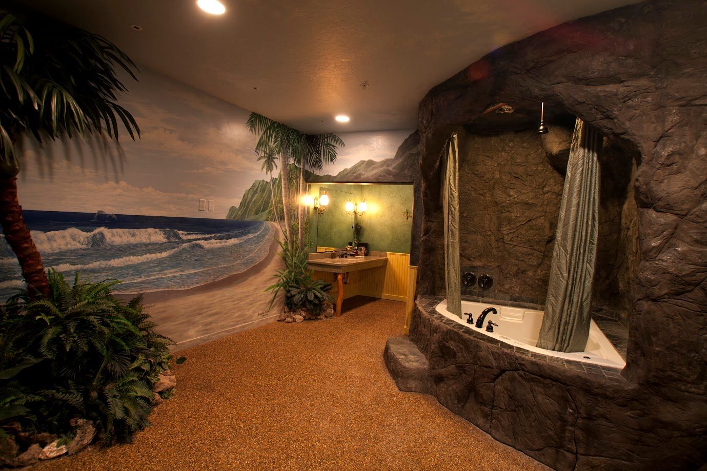 A bathroom with a bathtub and a painting of a beach on the wall.