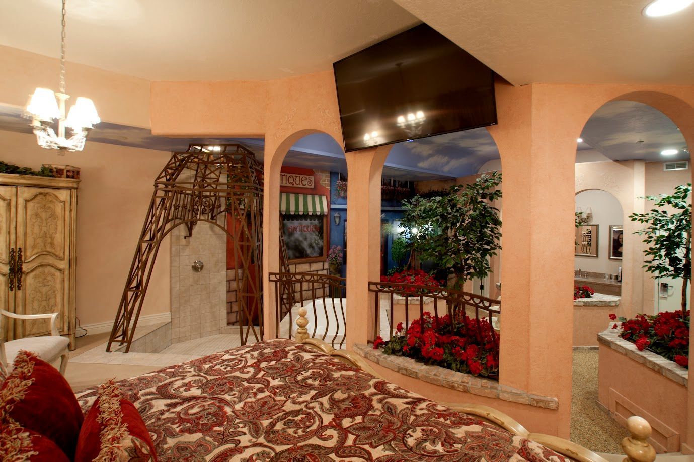 A bedroom with an eiffel tower in the corner