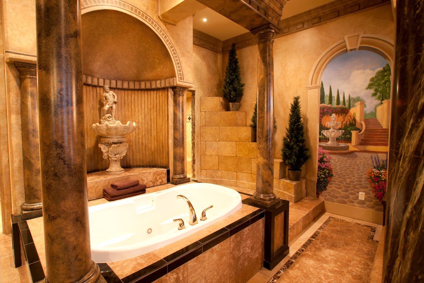 A bathroom with a large tub and a fountain