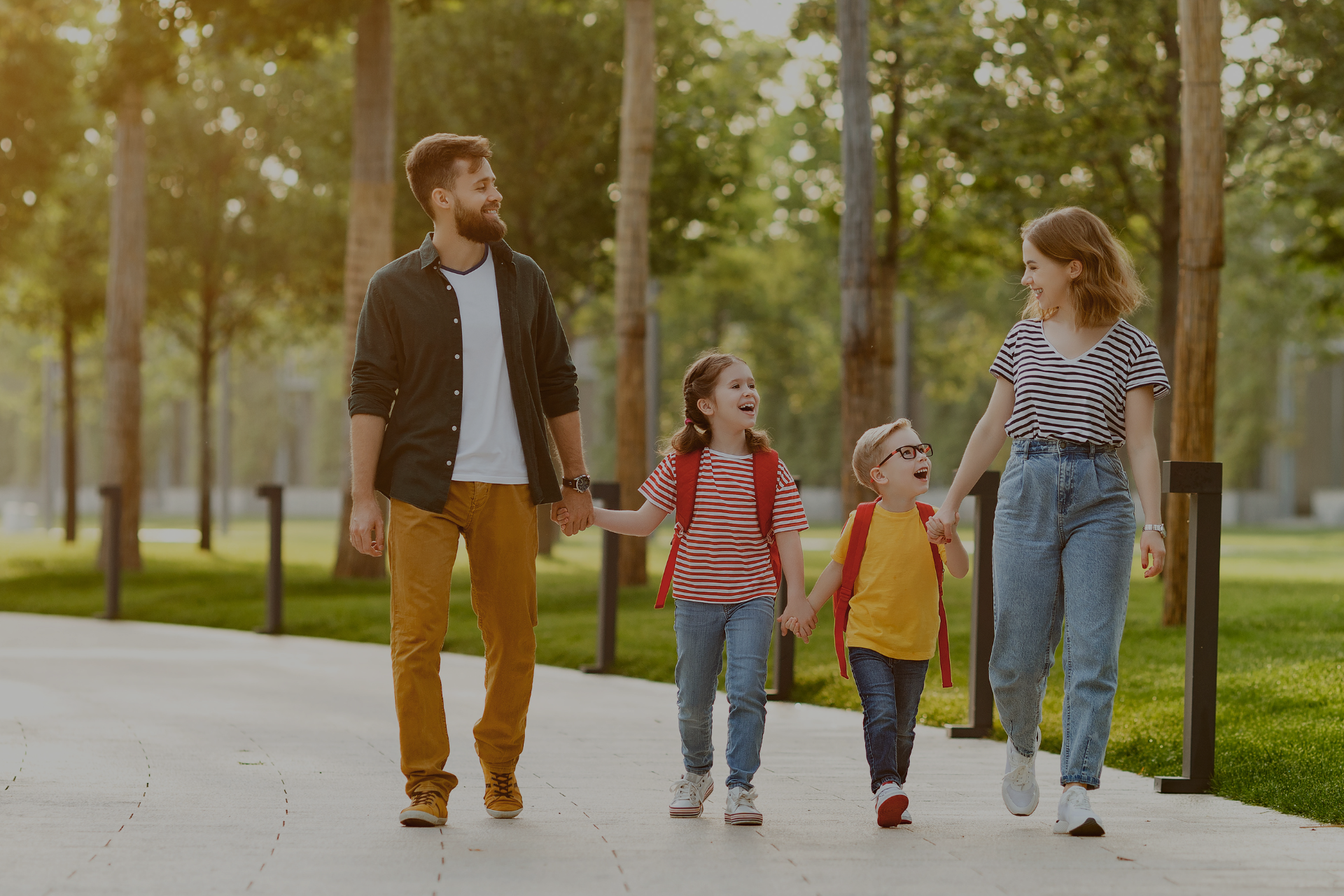 Mom, Dad, Daughter and Son walking on a path