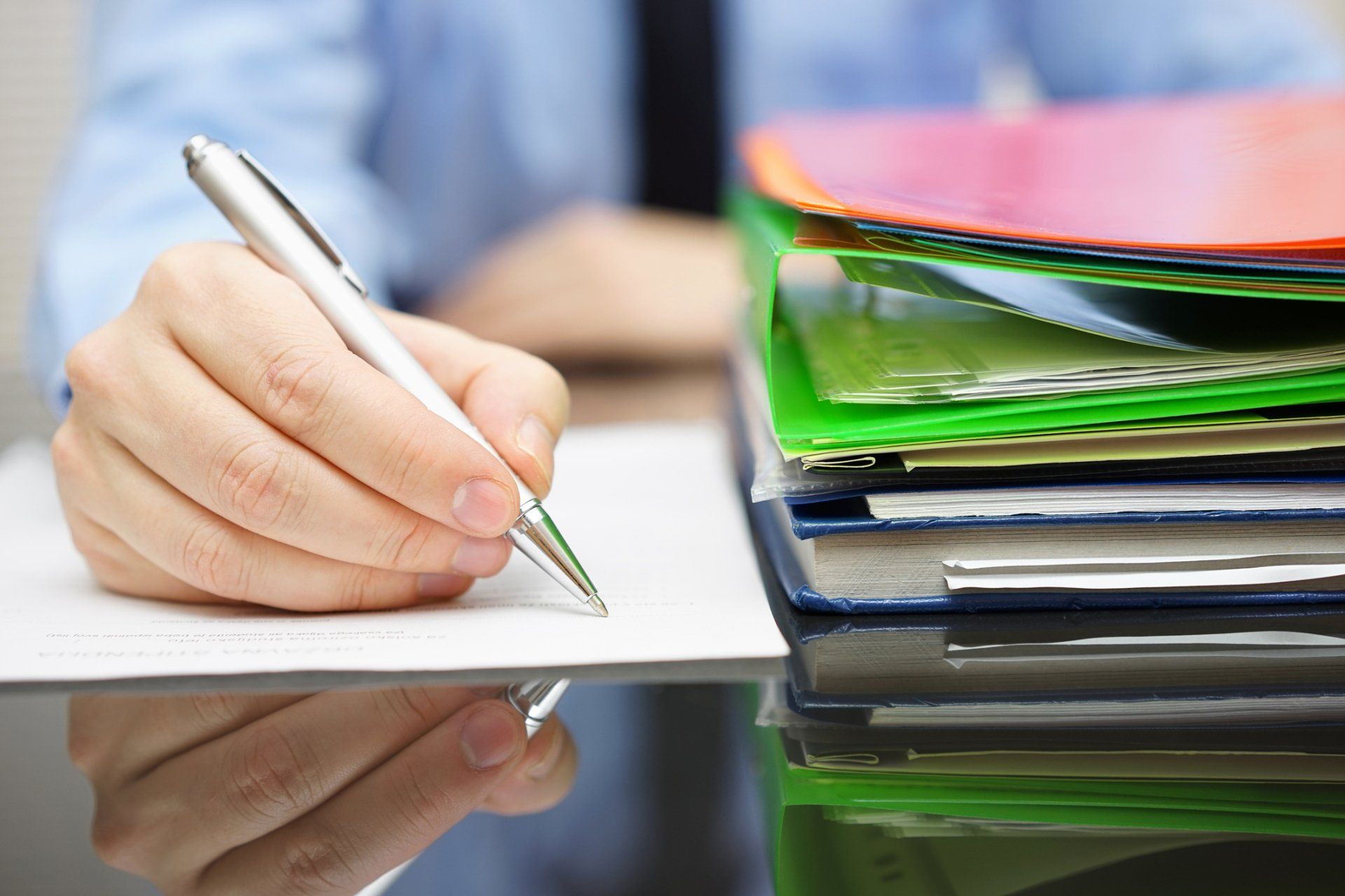 Businessman Is Writing On Document - Yucaipa, CA - The Income Tax Office