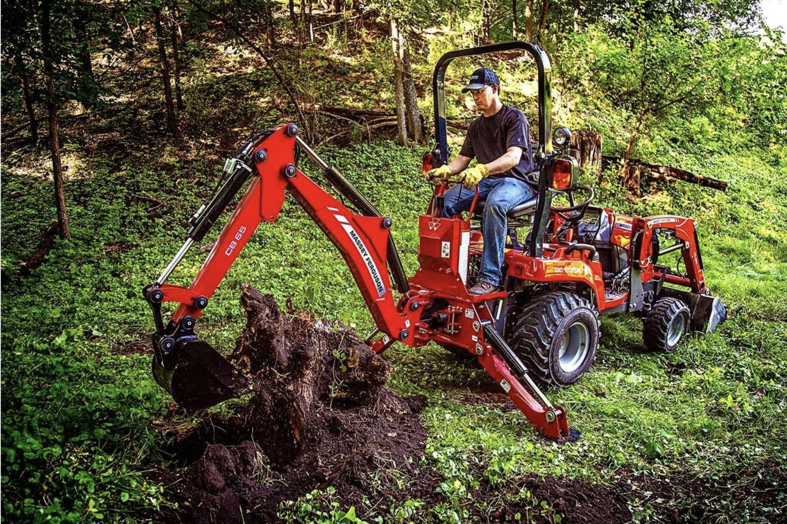 Man on tractor digging dirt