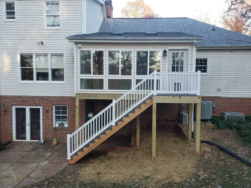 The back of a house with a deck and stairs