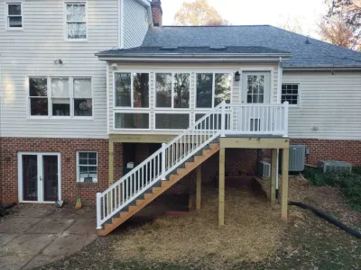The back of a house with a deck and stairs