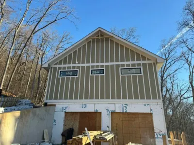 A garage is being built in the middle of a forest.