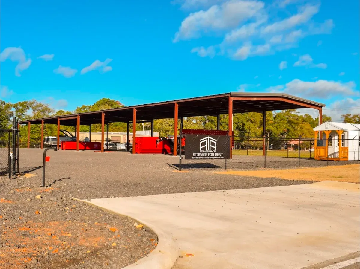 A large metal building with a sign on the side of it.