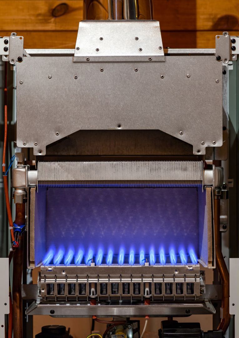 A gas heater with blue flames coming out of it