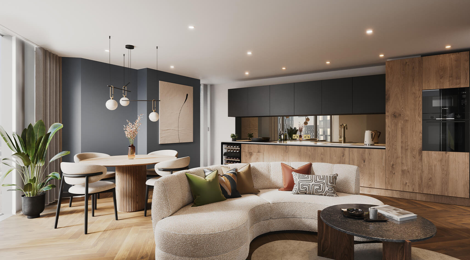 Modern living space with a curved sofa, dining area, and kitchen. Wooden floors and cabinetry, neutral tones.