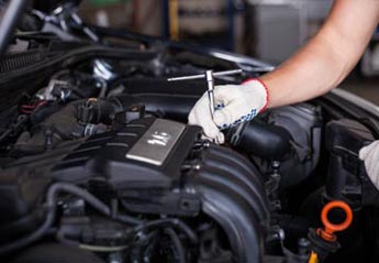 Mechanic Repairing An Engine — Radiator Repair In Billings, MT