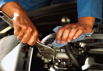 Mechanic Repairing An Engine Using A Wrench — Radiator Services In Billings, MT