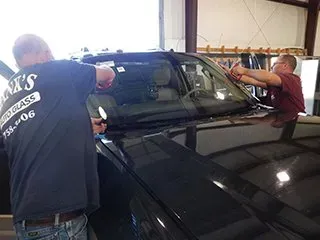 Man Installing New Glass — Tuscaloosa, AL — Hank's Auto Glass, Inc.