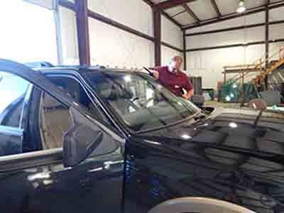 Man Installing New Windshield Glass — Tuscaloosa, AL — Hank's Auto Glass, Inc.