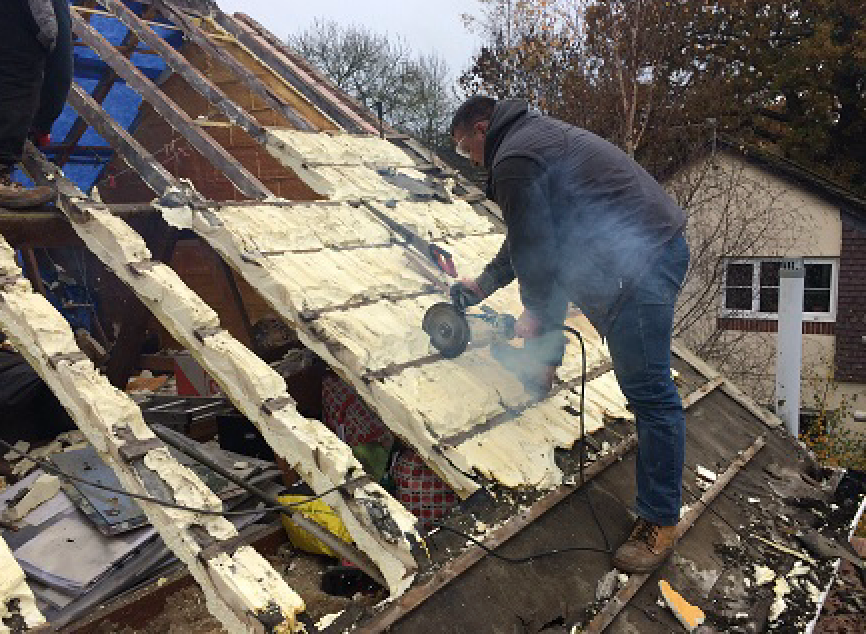 Man removing spray form for spray foam advice centre.