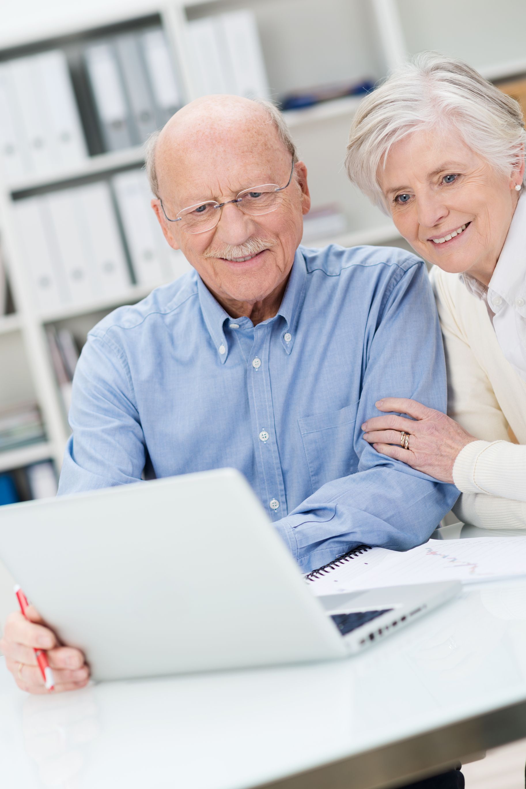 A man is holding up a loan application that has been rejected