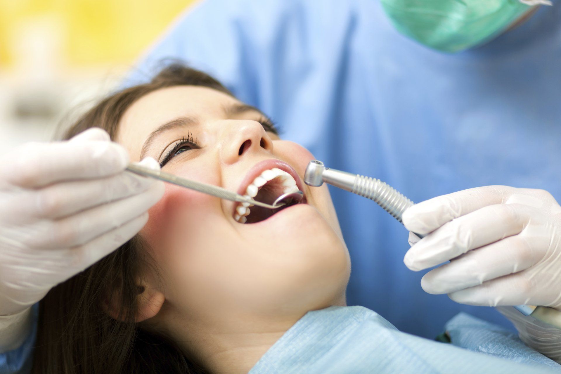 Woman Getting Her Teeth Cleaned — Houston, TX — On-Site Oral Surgery