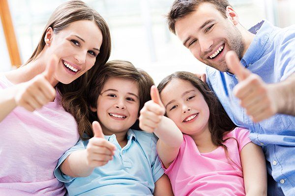 Family Giving Thumbs Up — Prospect, LA — Hargis Family Dental