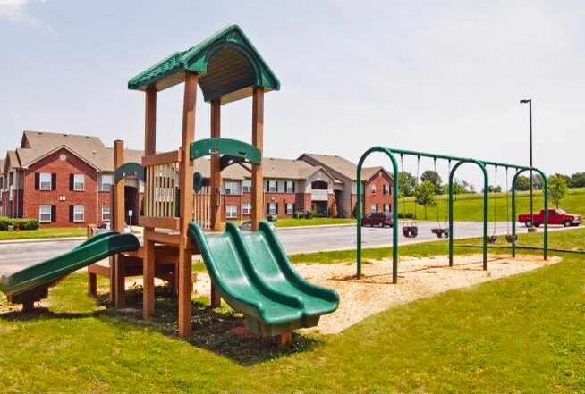 Photo of a playground with several slides