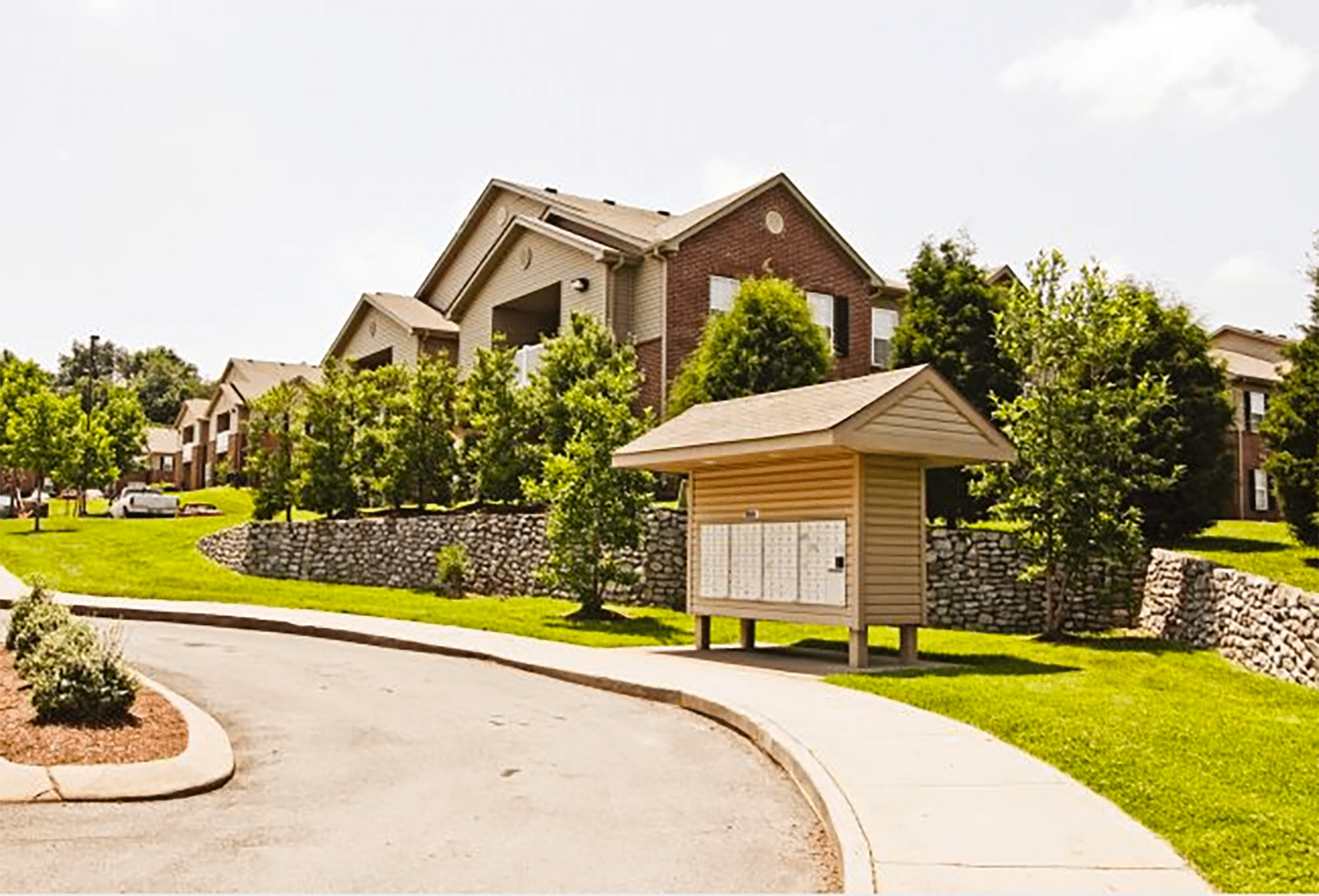 Photo of a driving path that goes up to a mailbox