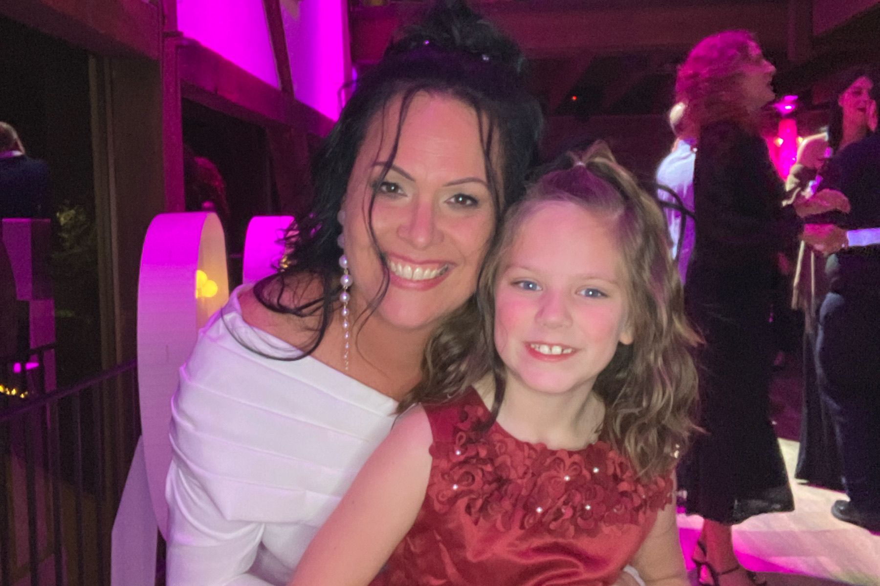 roaming photographer at barn on bridge with people on the dancefloor