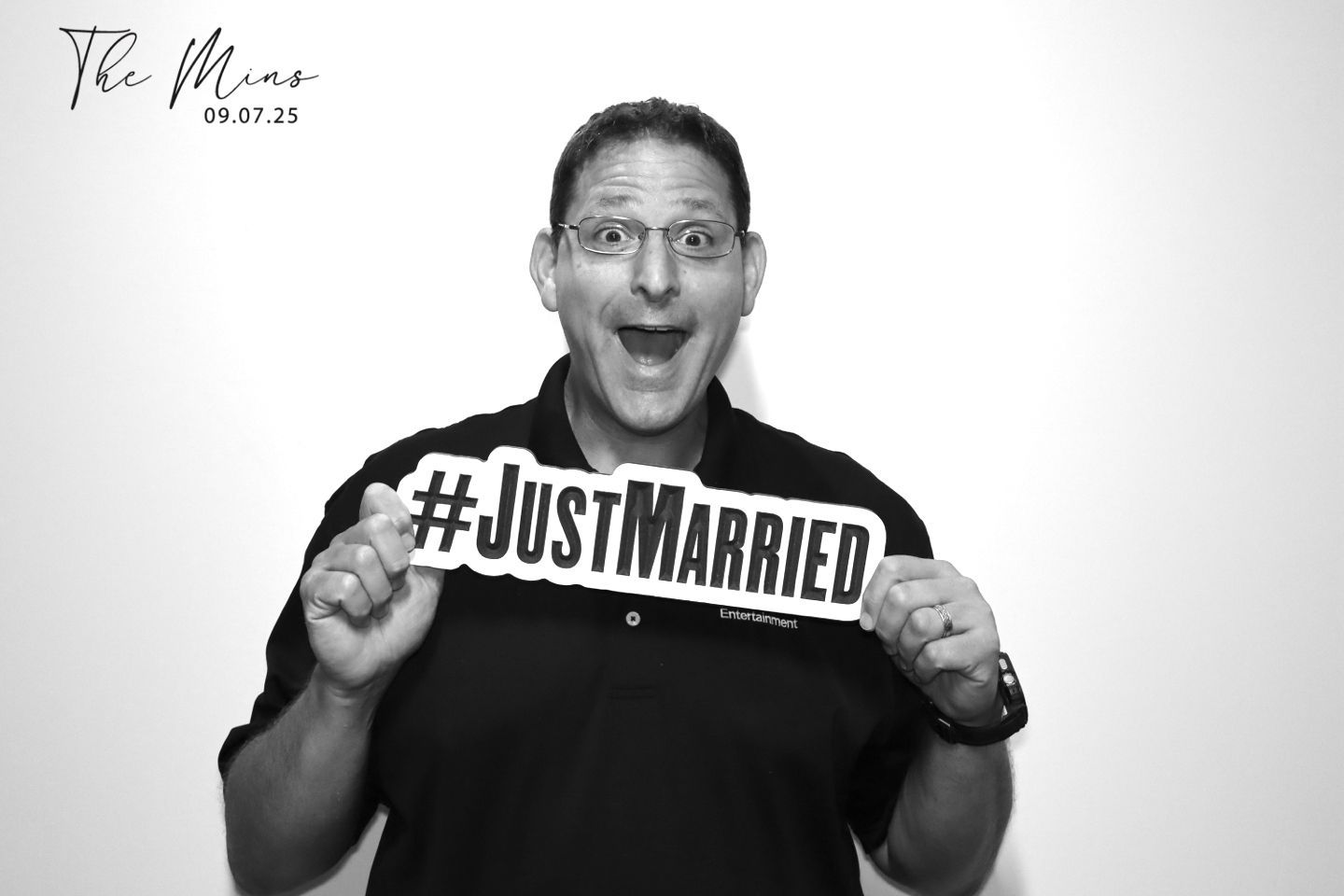black and white glam photo booth with #justmarried prop sign