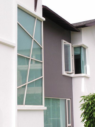 A white and gray building with a lot of windows