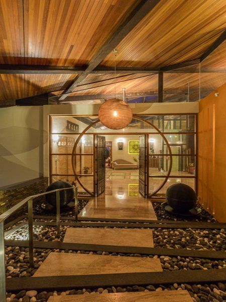 The entrance to a house with a wooden ceiling