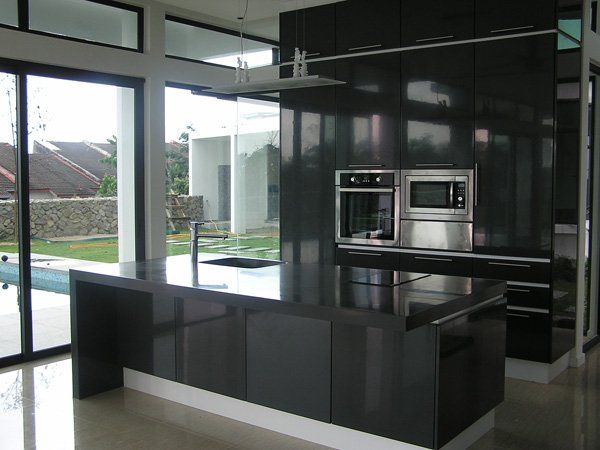 A kitchen with  windows and sliding doors