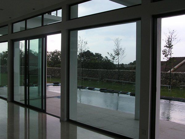 A room with  windows and sliding doors