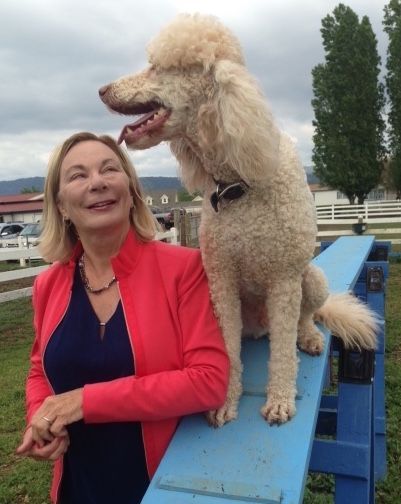 Theresa Clyde gives some luv to her standard poodle Apollo.