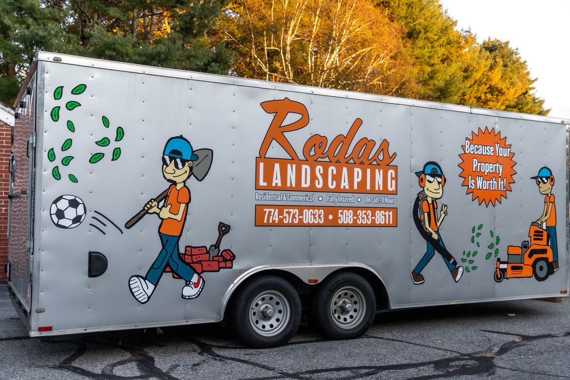 A trailer for radar landscaping is parked on the side of the road