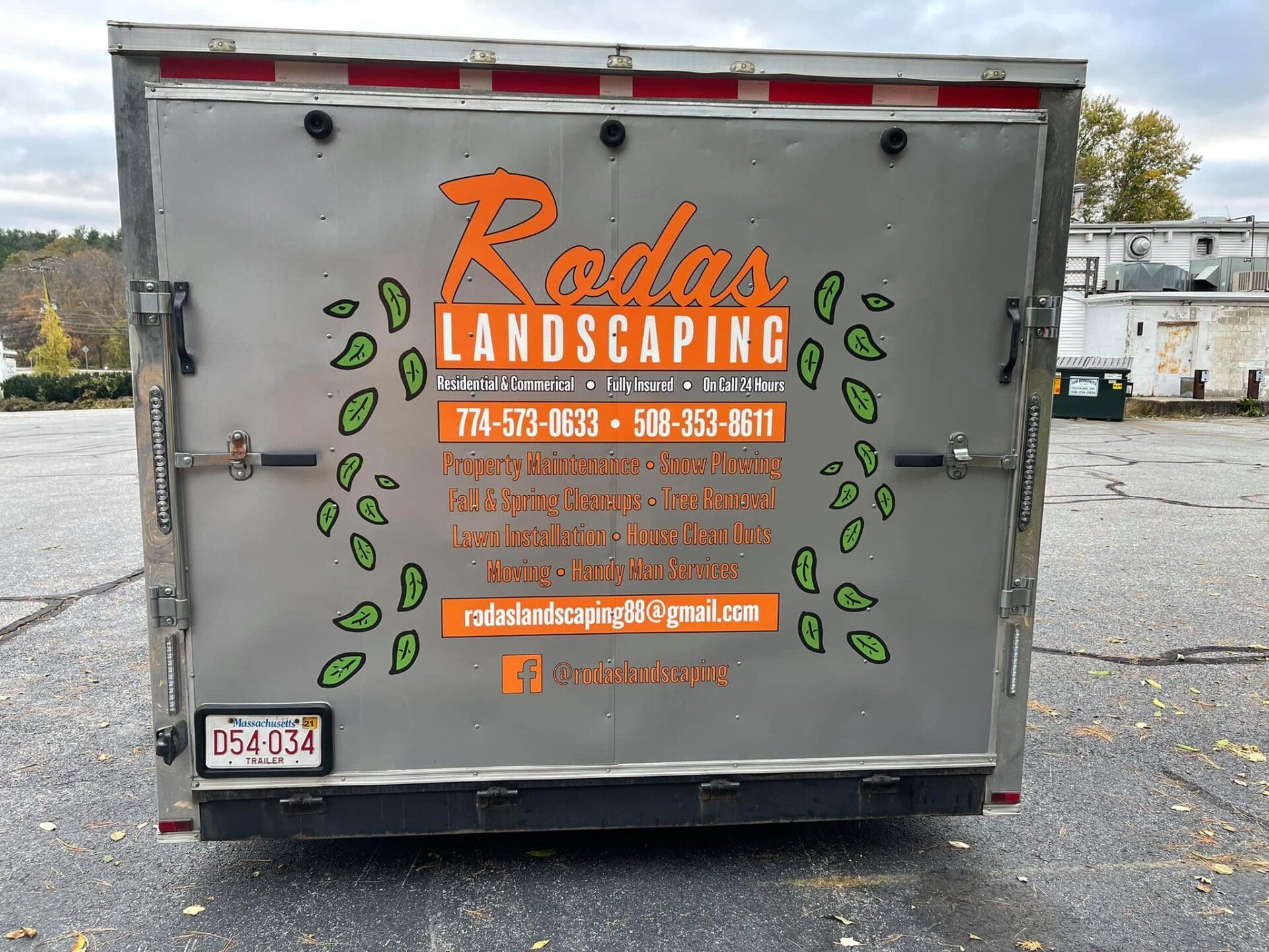 The back of a trailer with the word landscaping on it