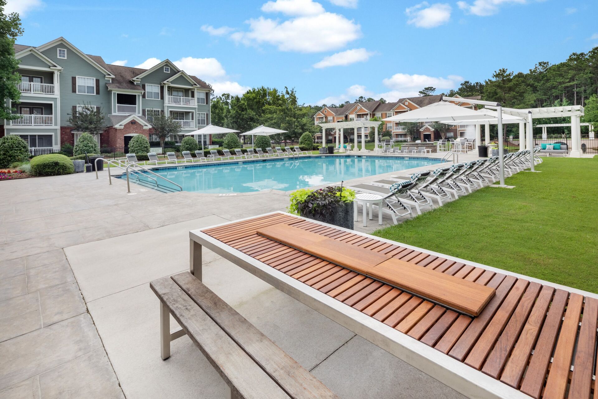 Bryant at Summerville | Resort-Inspired Swimming Pool with Seating Area