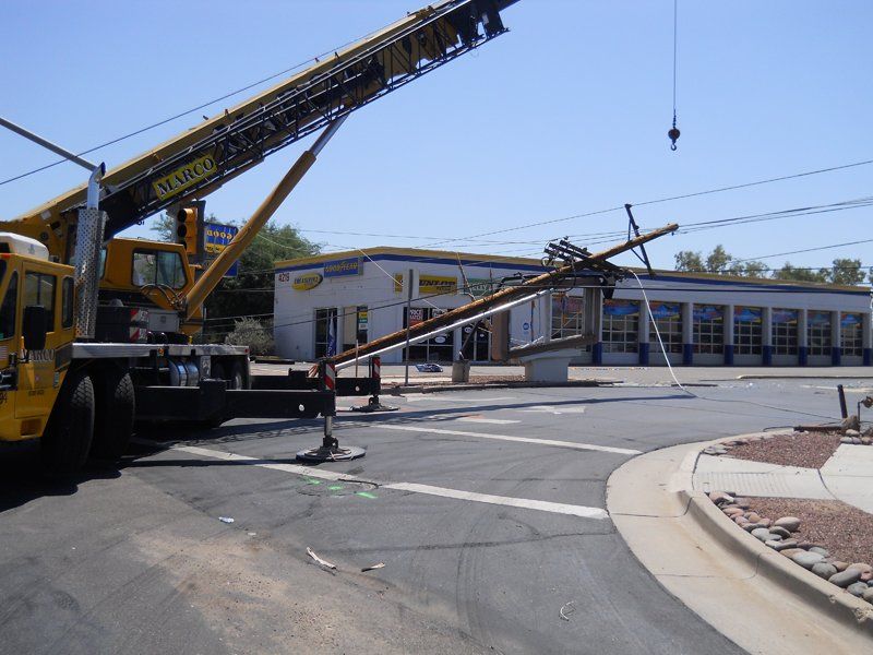 Excavation Services — Pole is Being Removed by Machine in Tucson, AZ