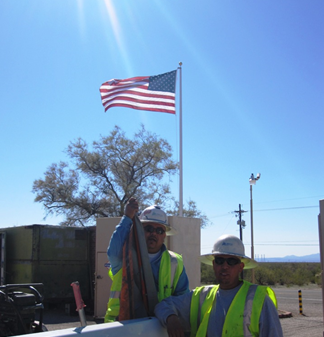 Trenching Services — American Flag Behind Men in Tucson, AZ