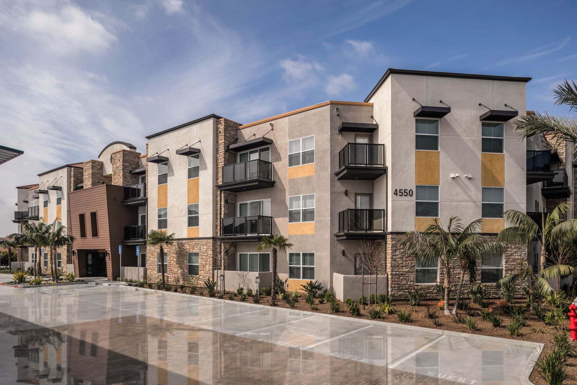 A large apartment building with a lot of windows and balconies