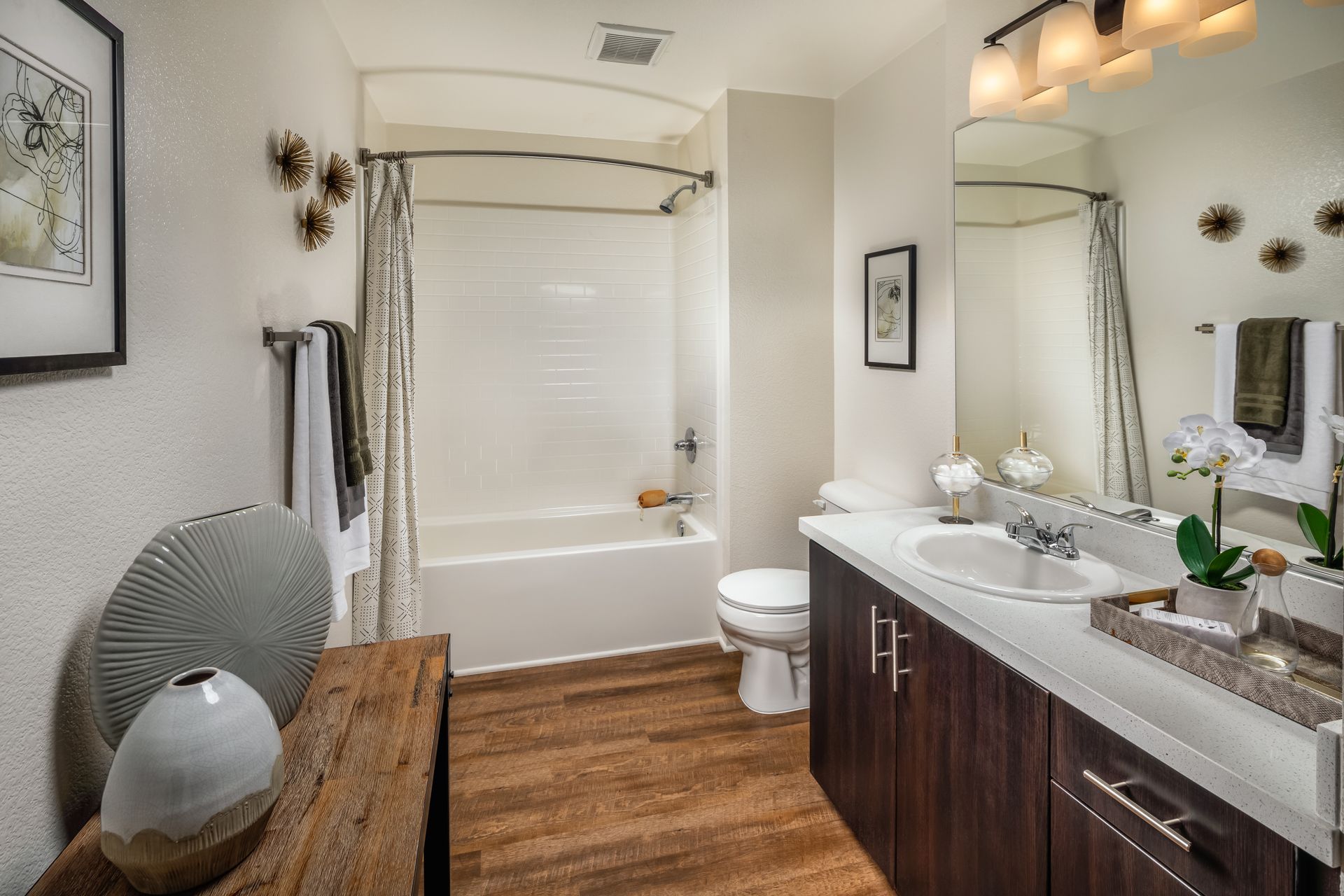 A bathroom with a sink , toilet and bathtub