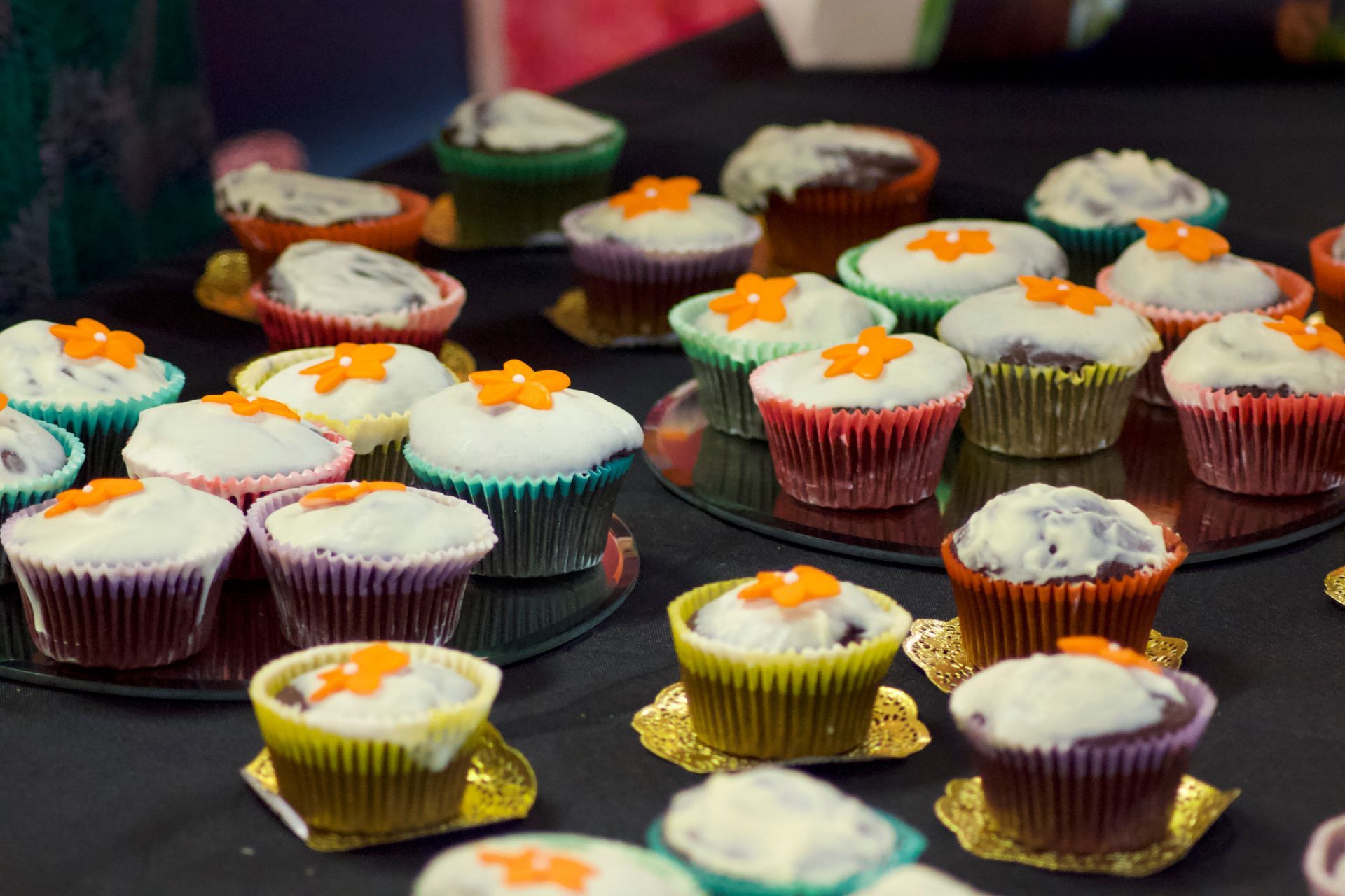 A bunch of cupcakes are sitting on a table