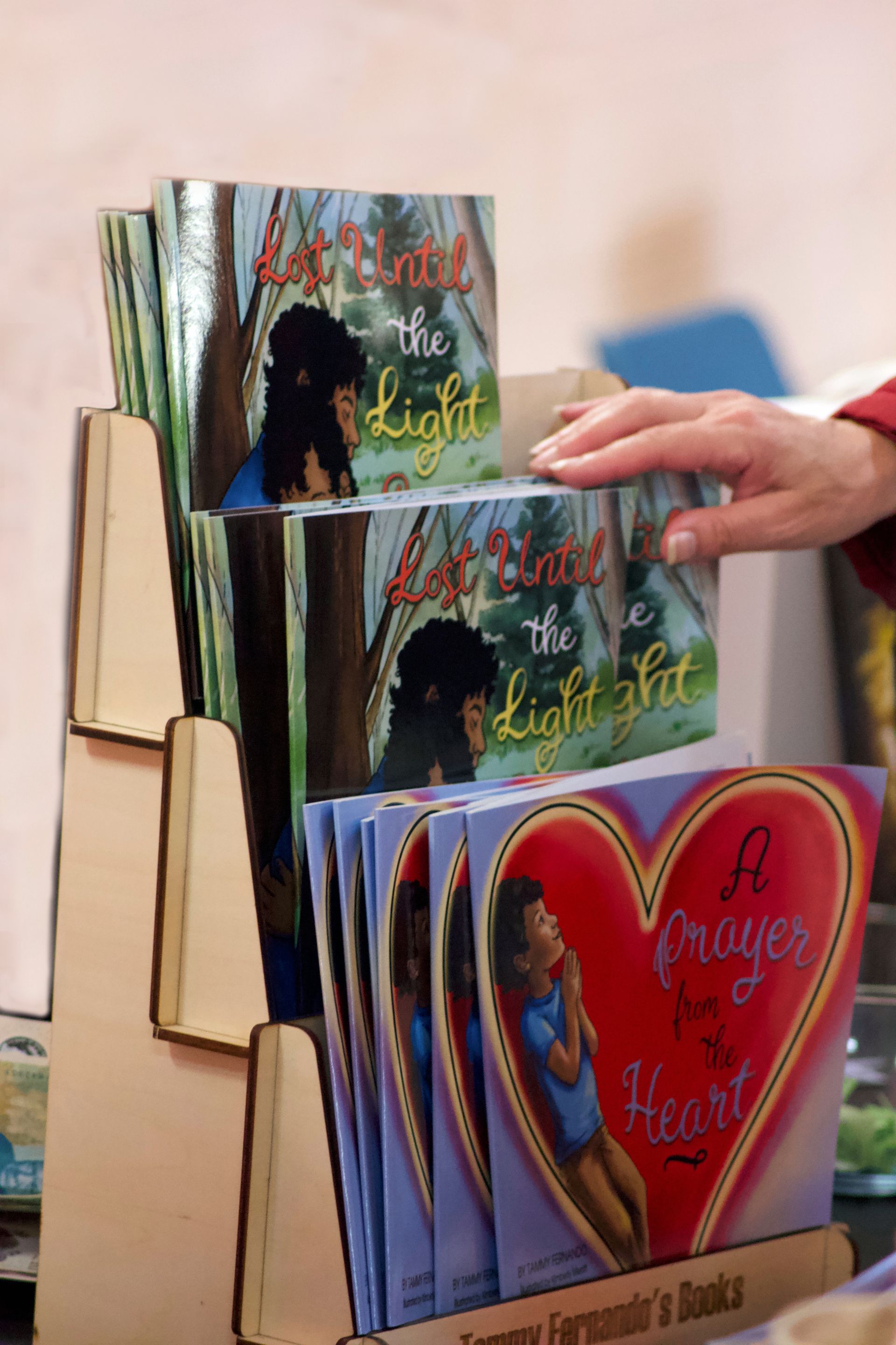 A person is holding a book titled a prayer from the heart