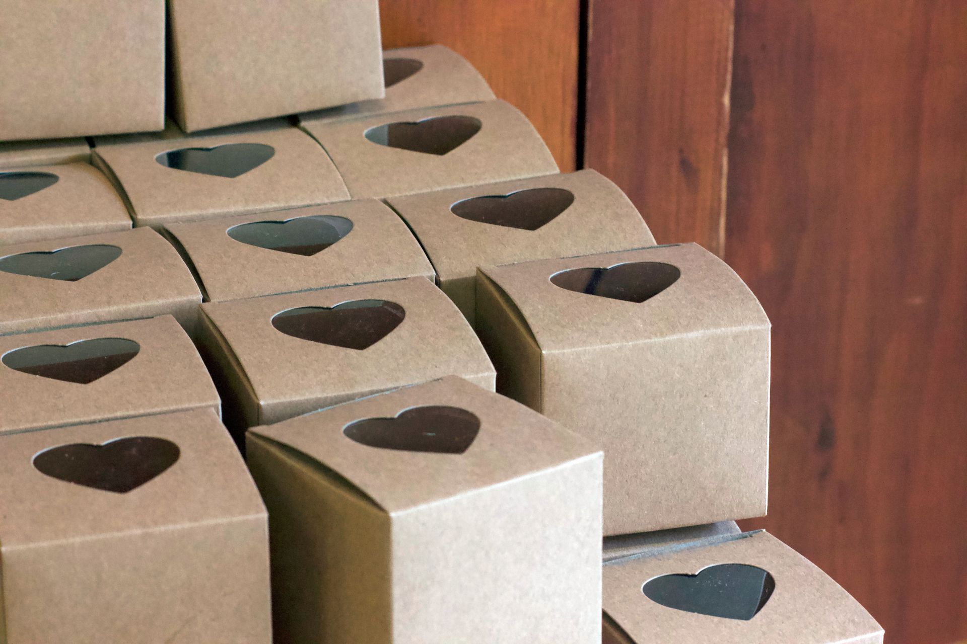 A stack of brown boxes with hearts cut out of them