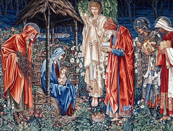 Lit candle in a glass jar, warm light against a dark background.