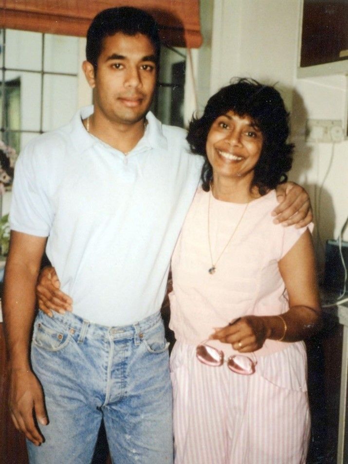 A man and a woman are posing for a picture together