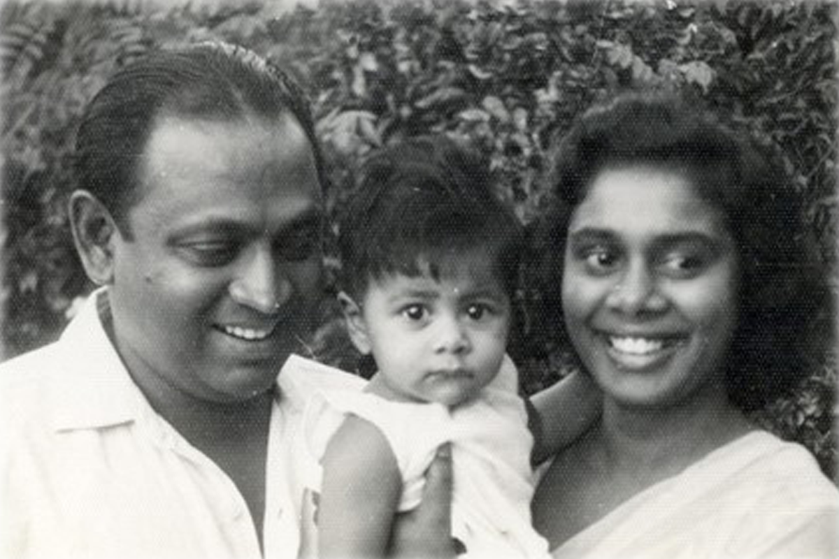 A black and white photo of Tammy Fernando as a baby with her parents.