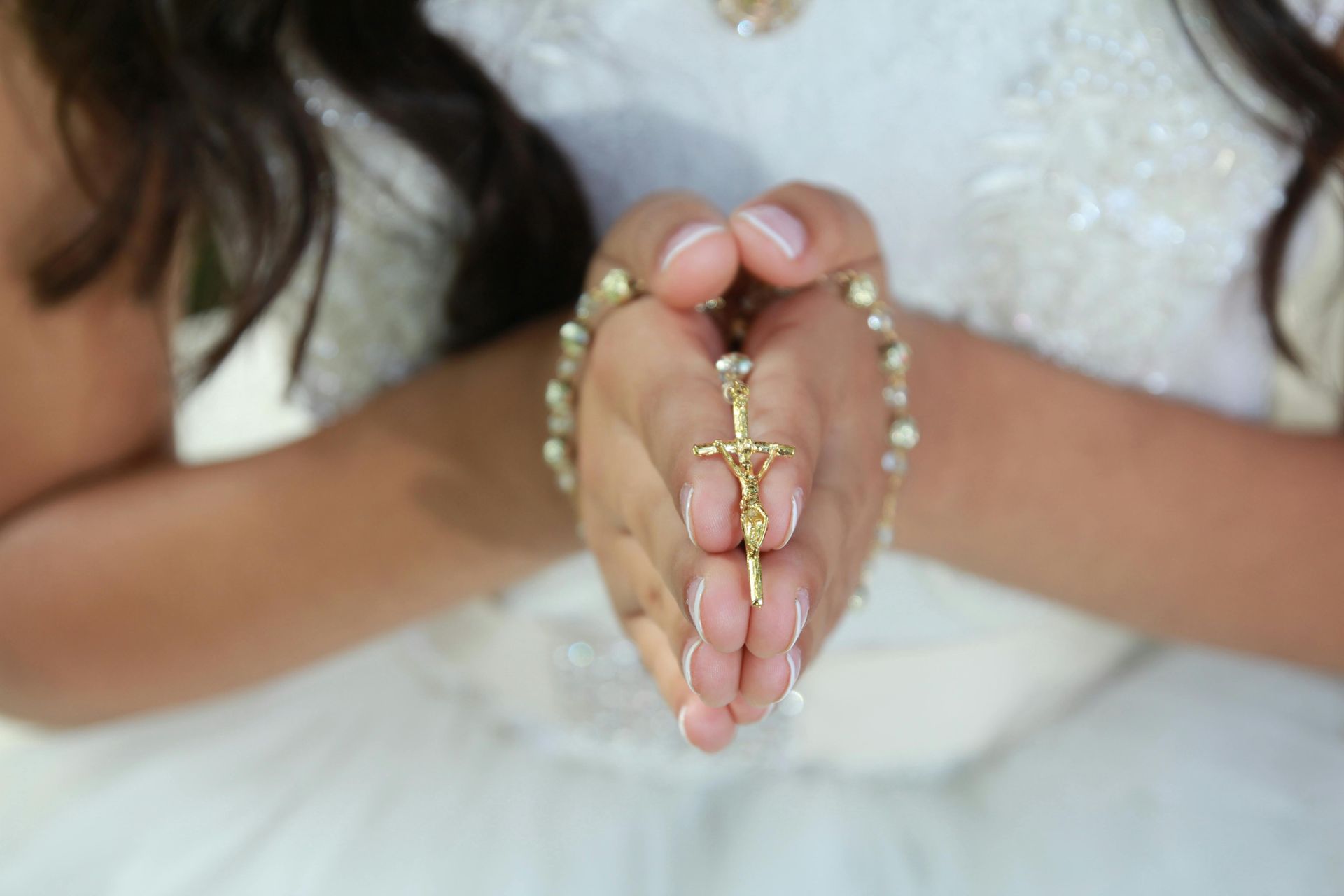 Girl holding a rosary