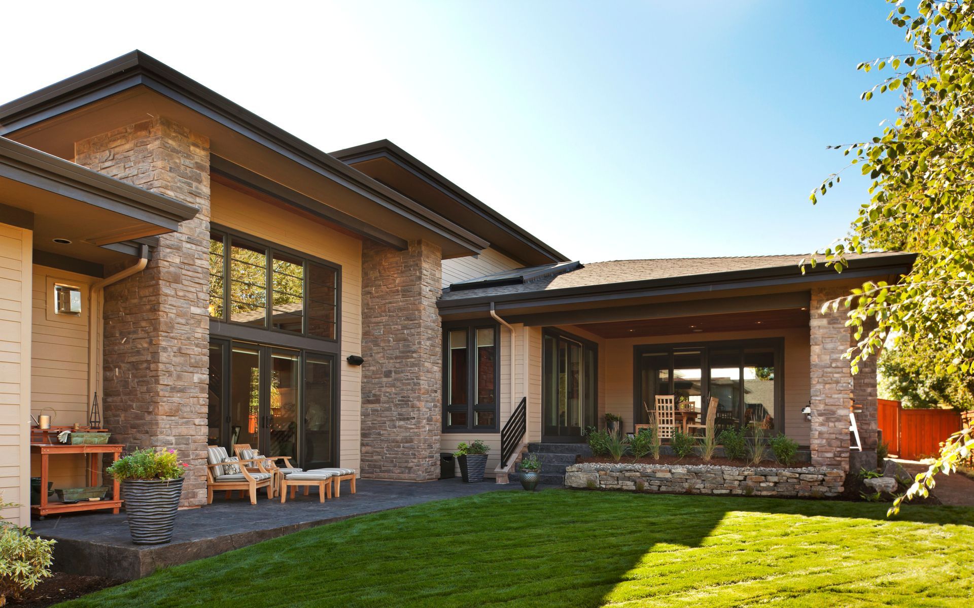 A cozy patio building with comfortable seating, plants, and soft natural light outdoors. 