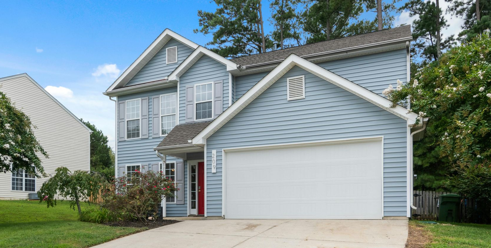 Local Home With White Garage Door in Greenwich, CT