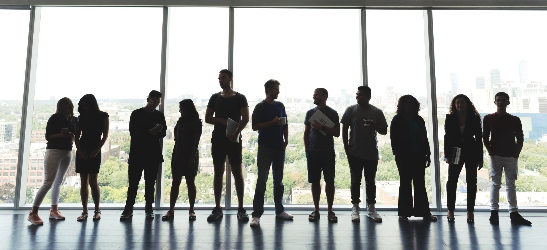 Photo Of Large Group Standing In An Office